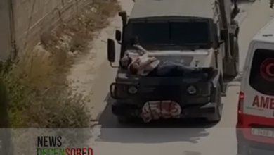 Image of a Palestinian strapped to Israeli vehicle sparks outrage.