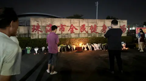 Deadly Car Rampage in Chinese Stadium Claims Dozen Dead.